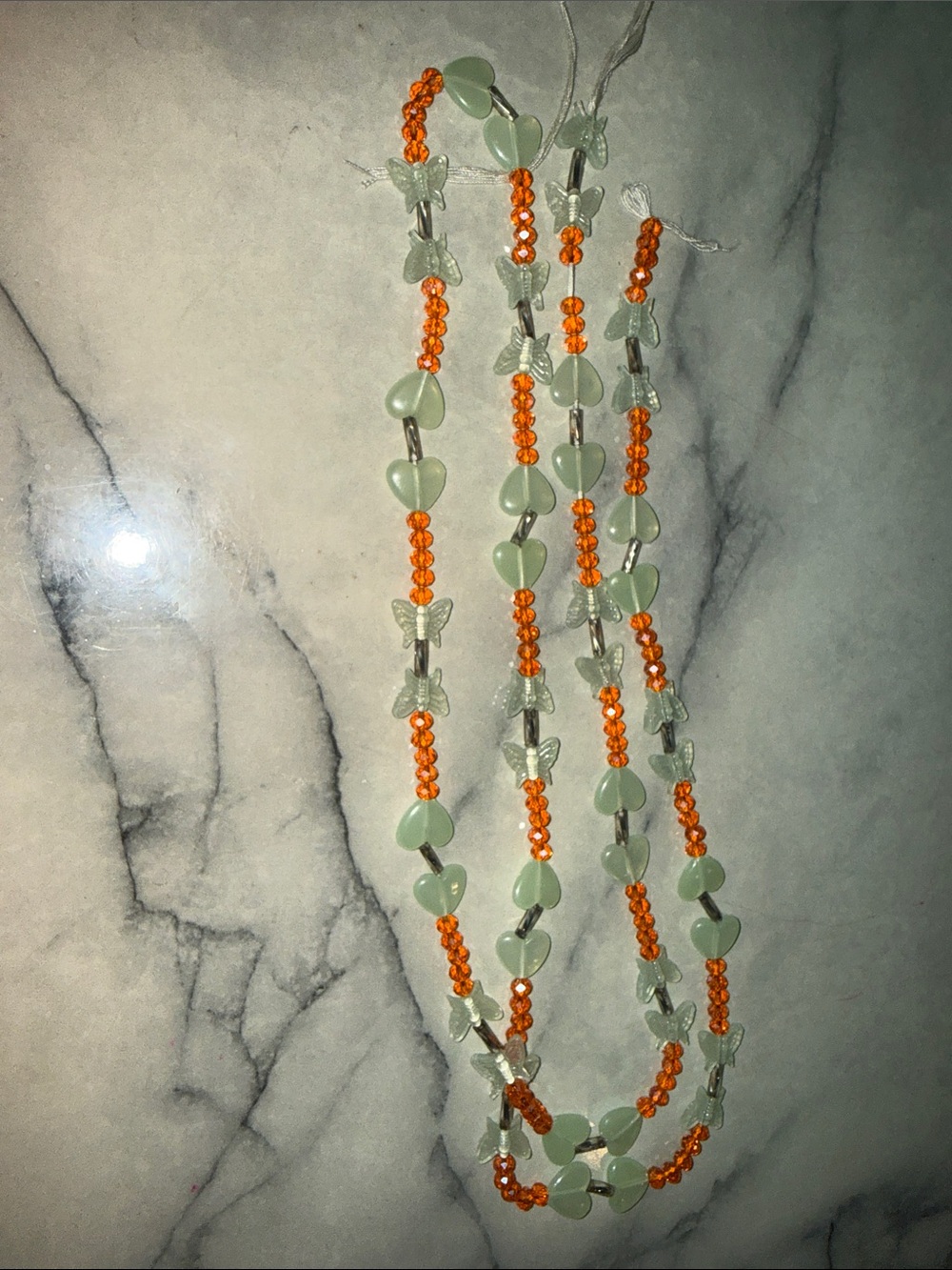 Glow in the dark butterfly and hearts waist beads.